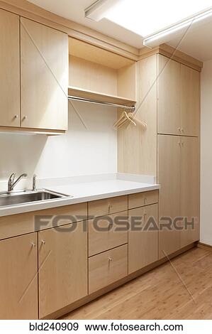 Cabinets and sink in modern room View Large Photo Image Stock Photo - Cabinets and sink in modern room. Fotosearch