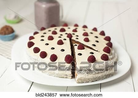 Stock Photo - Cake decorated with raspberries. Fotosearch