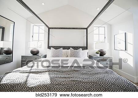 Stock Photo - Canopy bed in modern bedroom. Fotosearch