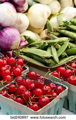 Stock Photo - Cartons of fresh vegetables at market. Fotosearch