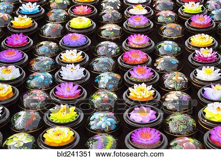 Stock Image - Carved soap lotus flowers in bowls. Fotosearch