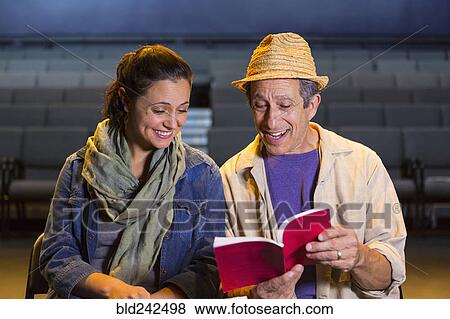 Caucasian actors rehearsing with script in theater View Large Photo Image Stock Photo - Caucasian actors rehearsing with script in theater. Fotosearch