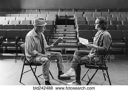 Caucasian actors rehearsing with scripts in theater View Large Photo Image Stock Photo - Caucasian actors rehearsing with scripts in theater. Fotosearch