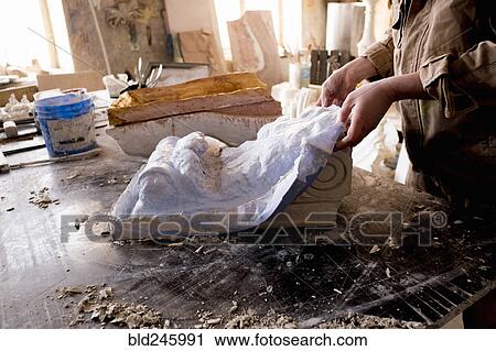 Caucasian artist lifting mold from plaster View Large Photo Image Stock Image - Caucasian artist lifting mold from plaster. Fotosearch