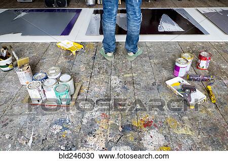 Stock Image - Caucasian artist painting in art studio. Fotosearch