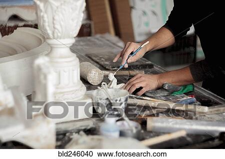 Caucasian artist sculpting with tool View Large Photo Image Stock Image - Caucasian artist sculpting with tool. Fotosearch