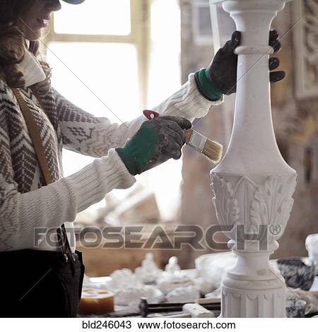 Caucasian artist using paintbrush on sculpture View Large Photo Image Stock Image - Caucasian artist using paintbrush on sculpture. Fotosearch