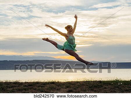 Caucasian ballerina jumping on beach View Large Photo Image Stock Image - Caucasian ballerina jumping on beach. Fotosearch