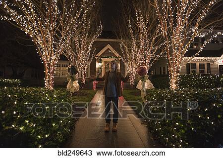 Caucasian boy admiring Christmas decorations in yard View Large Photo Image Stock Image - Caucasian boy admiring Christmas decorations in yard. Fotosearch