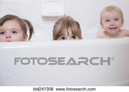 Caucasian boy and girls peaking from bathtub View Large Photo Image Stock Photo - Caucasian boy and girls peaking from bathtub. Fotosearch