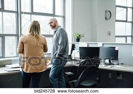 Stock Photo - Caucasian business people talking. Fotosearch