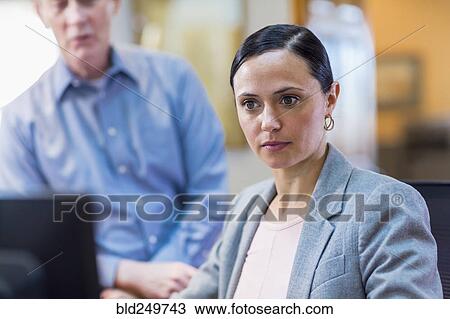 Caucasian business people using computer View Large Photo Image Stock Image - Caucasian business people using computer. Fotosearch