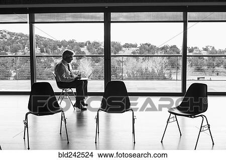 Picture - Caucasian businessman using laptop. Fotosearch