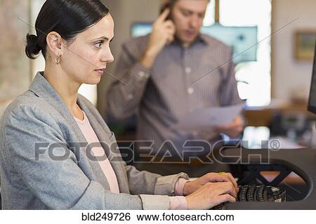 Stock Photograph - Caucasian businesswoman using computer. Fotosearch