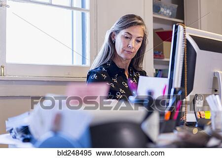 Stock Photography - Caucasian businesswoman using computer. Fotosearch