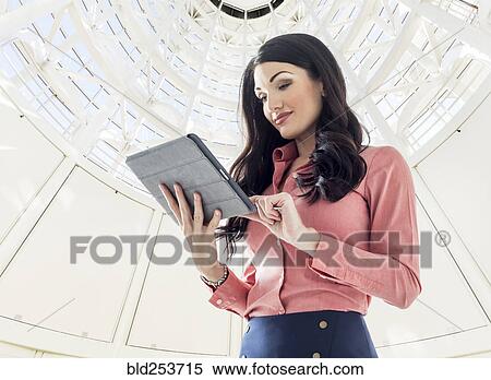 Caucasian businesswoman using digital tablet View Large Photo Image Stock Photography - Caucasian businesswoman using digital tablet. Fotosearch