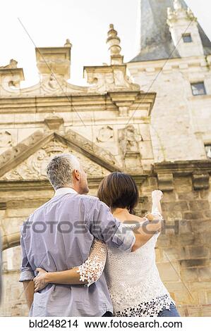Picture - Caucasian couple admiring building. Fotosearch