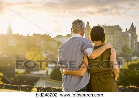Caucasian couple admiring scenic view View Large Photo Image Stock Image - Caucasian couple admiring scenic view. Fotosearch