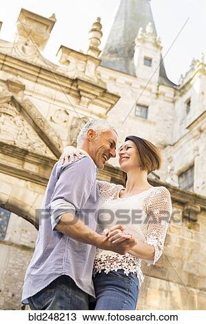 Caucasian couple dancing near building View Large Photo Image Stock Image - Caucasian couple dancing near building. Fotosearch