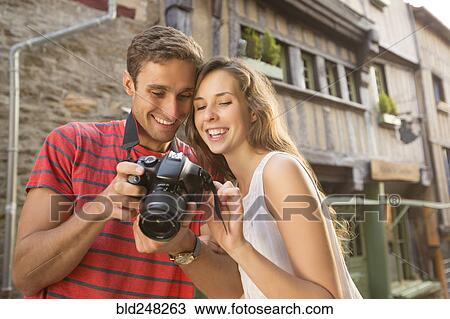 Stock Image - Caucasian couple examining the camera. Fotosearch
