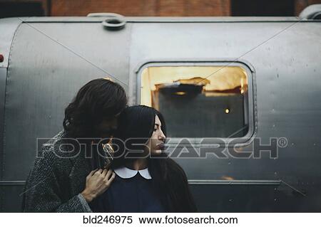 Caucasian couple near metal container View Large Photo Image Stock Photography - Caucasian couple near metal container. Fotosearch