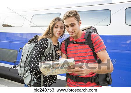 Caucasian couple reading math near train View Large Photo Image Stock Image - Caucasian couple reading math near train. Fotosearch