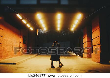 Caucasian couple standing on street in tunnel View Large Photo Image Stock Photo - Caucasian couple standing on street in tunnel. Fotosearch