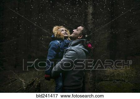 Caucasian father and daughter under starry sky View Large Photo Image Stock Photo - Caucasian father and daughter under starry sky. Fotosearch