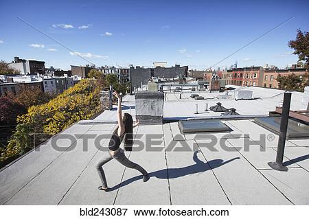 Caucasian girl dancing on rooftop View Large Photo Image Stock Photo - Caucasian girl dancing on rooftop. Fotosearch