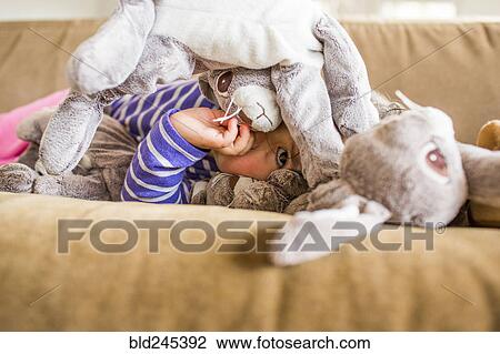 Caucasian girl laying on sofa sucking thumb View Large Photo Image Stock Image - Caucasian girl laying on sofa sucking thumb. Fotosearch