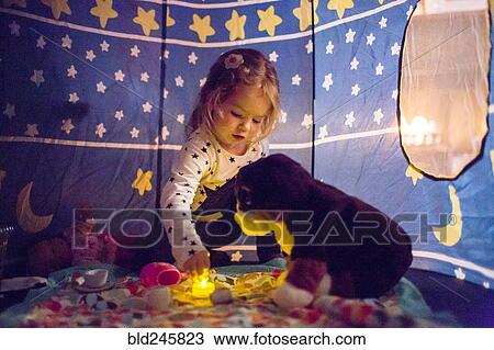 Caucasian girl playing in tent View Large Photo Image Stock Image - Caucasian girl playing in tent. Fotosearch
