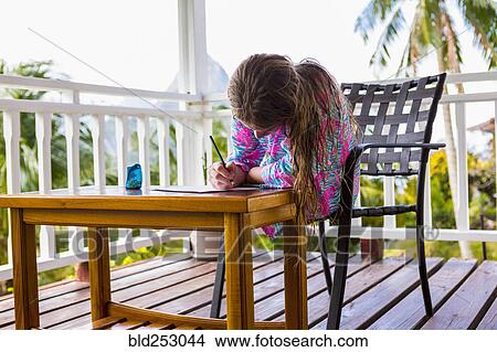 Caucasian girl sitting on balcony drawing on paper View Large Photo Image Picture - Caucasian girl sitting on balcony drawing on paper. Fotosearch