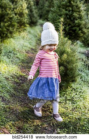 Stock Photo - Caucasian girl walking on path. Fotosearch