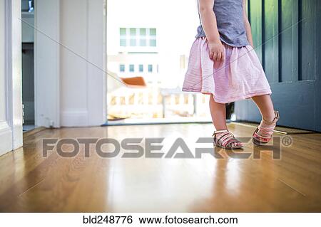 Caucasian girl wearing skirt and sandals View Large Photo Image Stock Photograph - Caucasian girl wearing skirt and sandals. Fotosearch