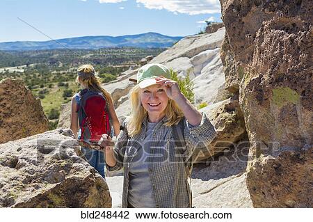 Caucasian grandmother hiking with granddaughter near rocks View Large Photo Image Stock Image - Caucasian grandmother hiking with granddaughter near rocks. Fotosearch