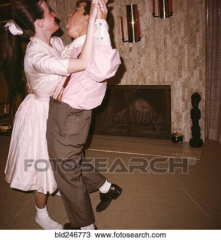 Caucasian man and woman dancing near fireplace View Large Photo Image Stock Image - Caucasian man and woman dancing near fireplace. Fotosearch