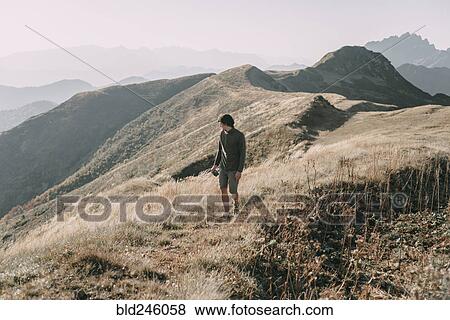 Caucasian man hiking on mountain View Large Photo Image Stock Photo - Caucasian man hiking on mountain. Fotosearch