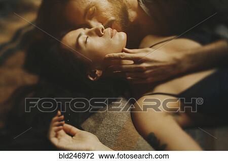 Caucasian man kissing woman on cheek View Large Photo Image Stock Image - Caucasian man kissing woman on cheek. Fotosearch
