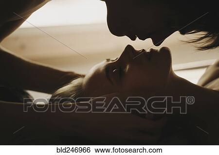 Caucasian man leaning over face of woman View Large Photo Image Stock Photograph - Caucasian man leaning over face of woman. Fotosearch