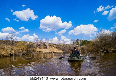 Caucasian man paddling in canoe View Large Photo Image Stock Image - Caucasian man paddling in canoe. Fotosearch