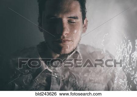 Caucasian man wearing shirt laying underwater in bathtub View Large Photo Image Stock Photograph - Caucasian man wearing shirt laying underwater in bathtub. Fotosearch