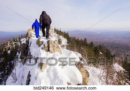 Caucasian men hiking on mountain in winter View Large Photo Image Stock Photograph - Caucasian men hiking on mountain in winter. Fotosearch