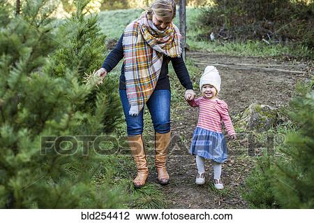 Caucasian mother and daughter walking on path View Large Photo Image Stock Image - Caucasian mother and daughter walking on path. Fotosearch