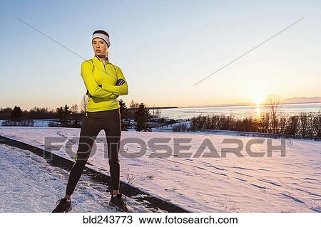 Caucasian runner posing with arms crossed in winter View Large Photo Image Stock Image - Caucasian runner posing with arms crossed in winter. Fotosearch