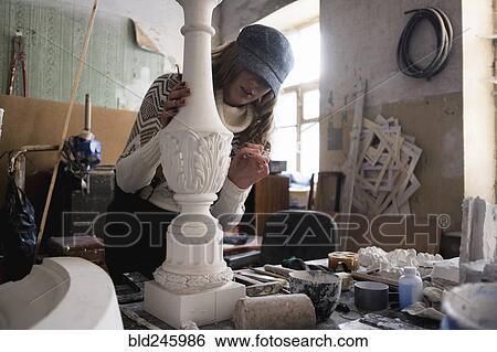 Caucasian sculptor carving plaster piece View Large Photo Image Stock Photograph - Caucasian sculptor carving plaster piece. Fotosearch