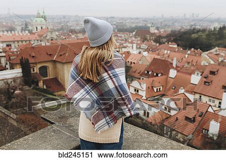 Caucasian woman admiring cityscape from rooftop View Large Photo Image Stock Image - Caucasian woman admiring cityscape from rooftop. Fotosearch