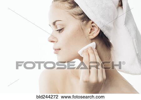 Caucasian woman cleaning chin with pad View Large Photo Image Stock Image - Caucasian woman cleaning chin with pad. Fotosearch