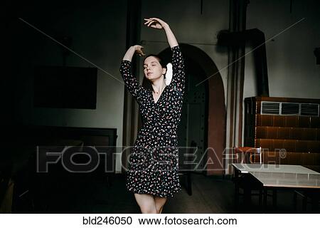 Caucasian woman dancing in livingroom View Large Photo Image Stock Image - Caucasian woman dancing in livingroom. Fotosearch