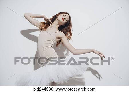 Stock Photograph - Caucasian woman dancing wearing tutu. Fotosearch