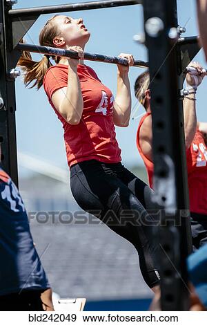 Caucasian woman doing chin-ups View Large Photo Image Stock Photo - Caucasian woman doing chin-ups. Fotosearch